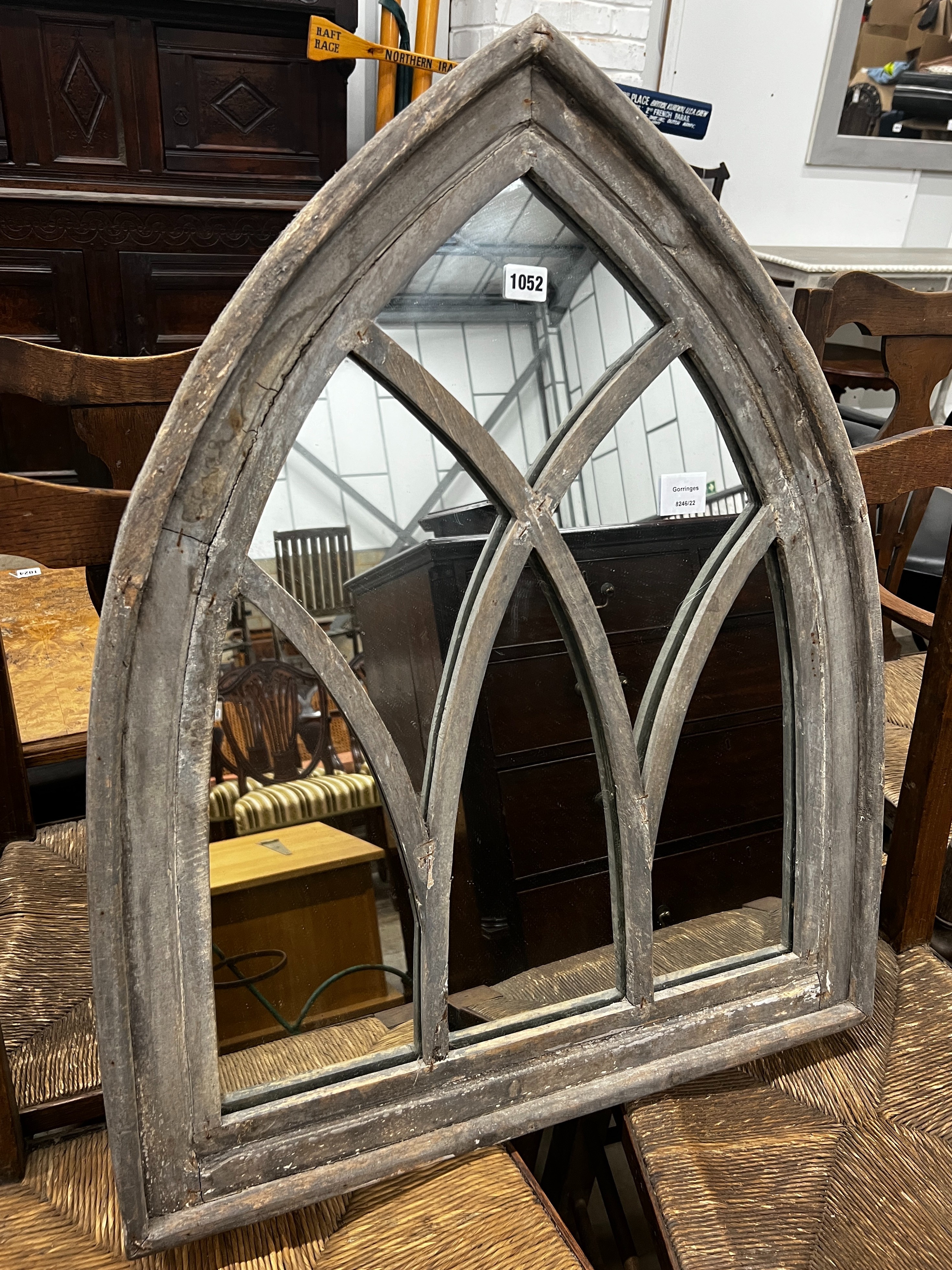 A gothic style painted arched wall mirror, width 66cm, height 81cm